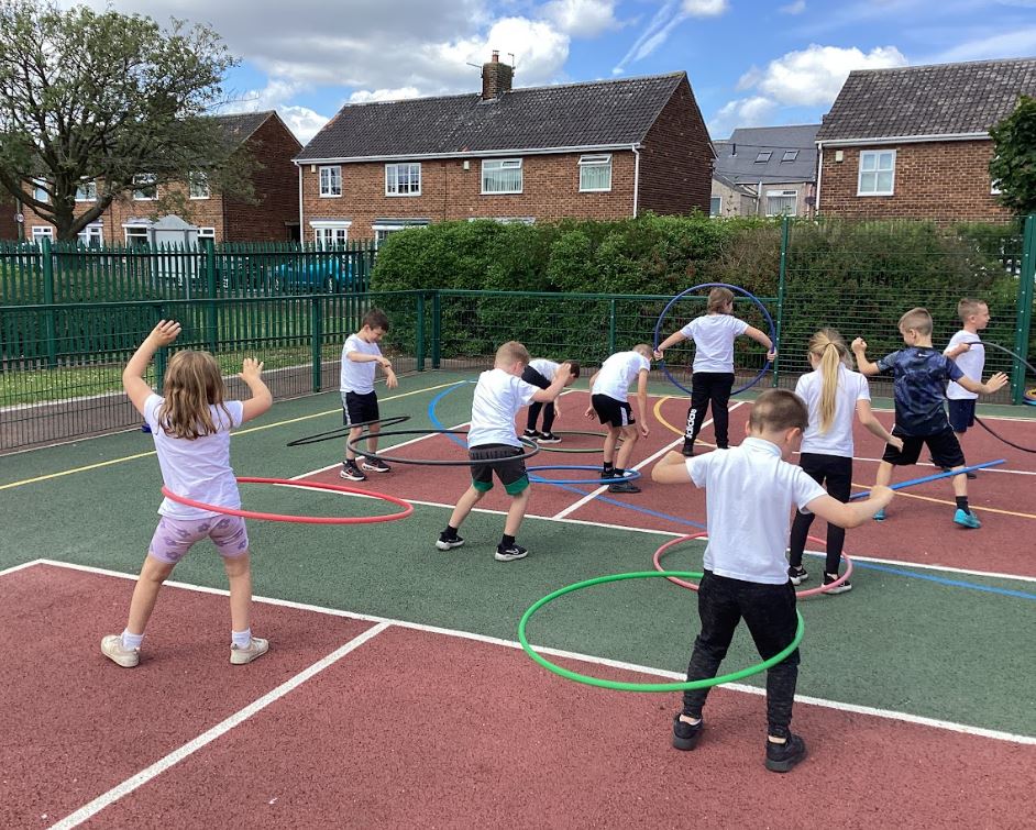 Children hula hooping.